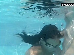 submerged underwater with a man sausage inside her