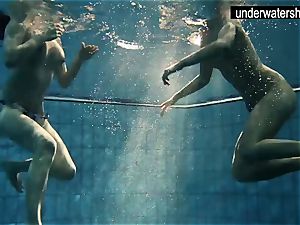 two wonderful amateurs demonstrating their bodies off under water